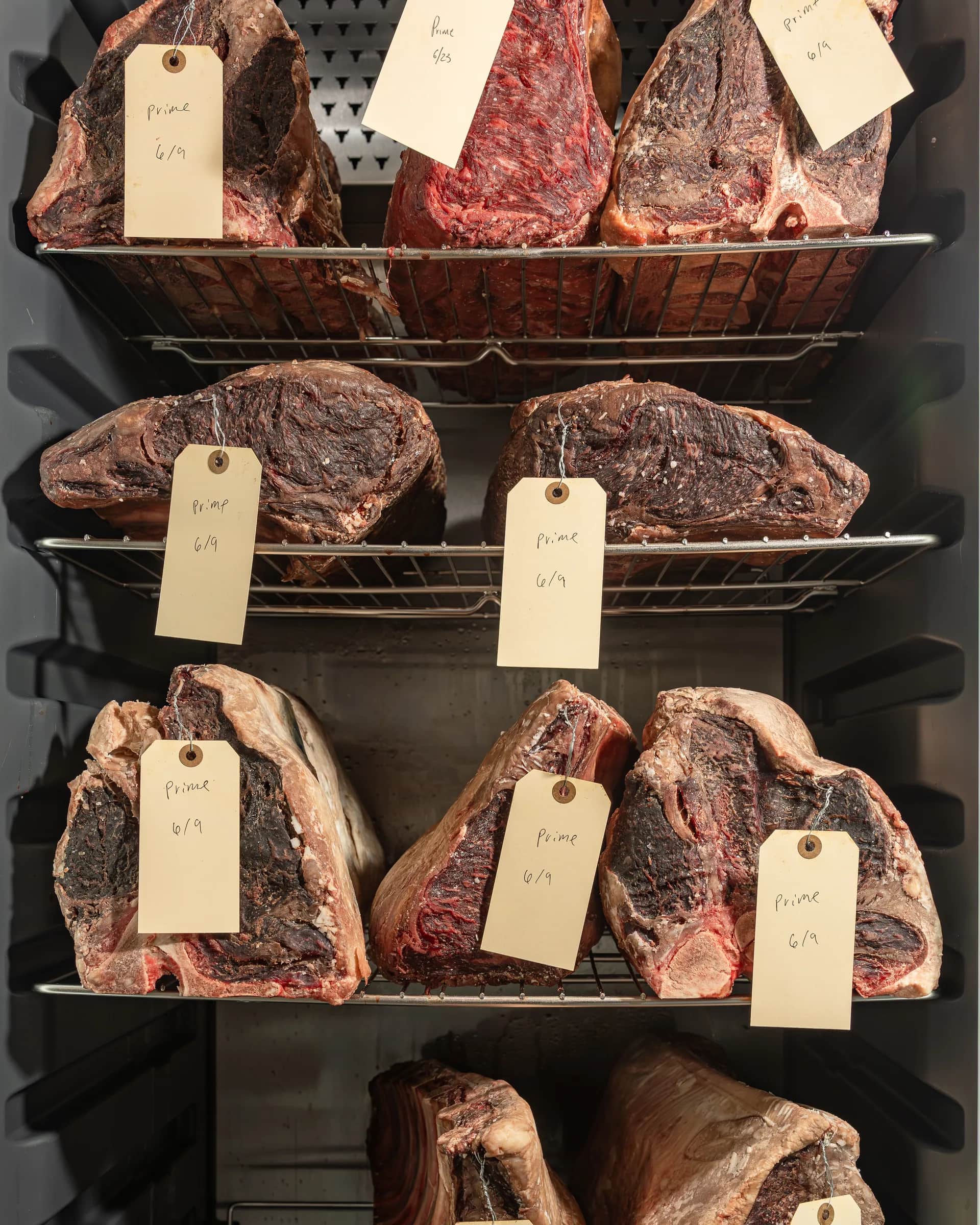 Three tiers of dry-aged beef in the aging locker