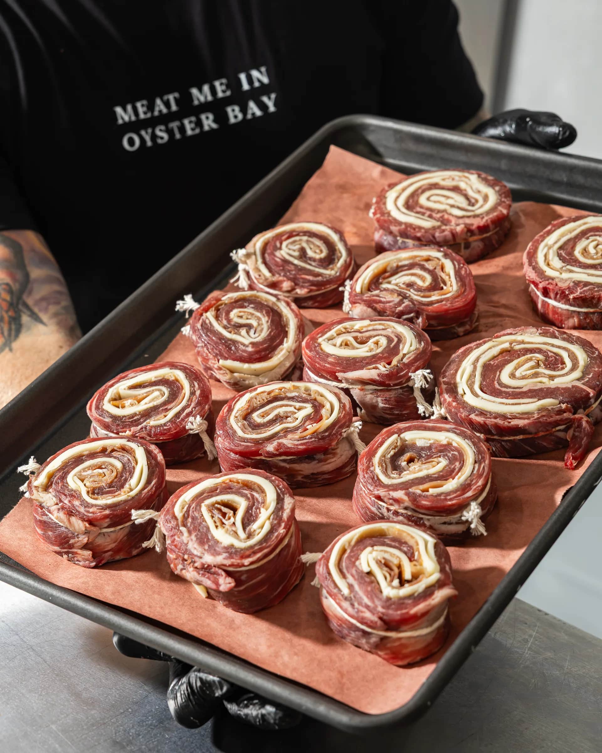 Angled tray of beef braciole pinwheels
