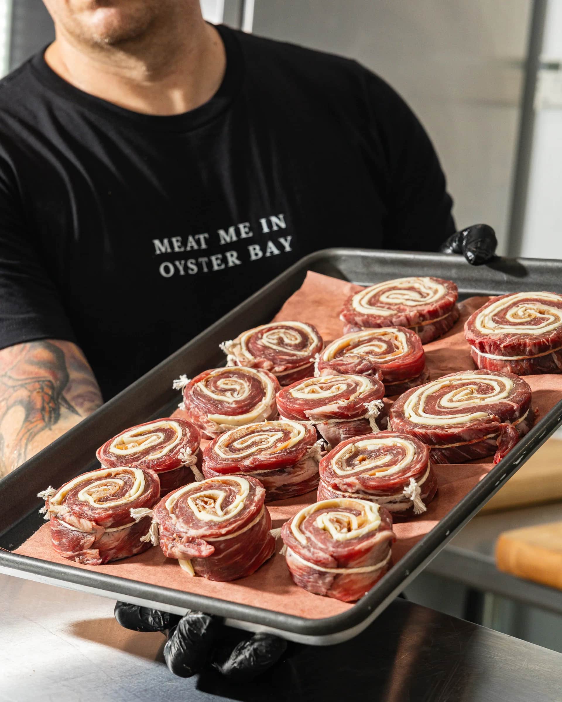 A tray of flank steak pinwheels ready for the grill